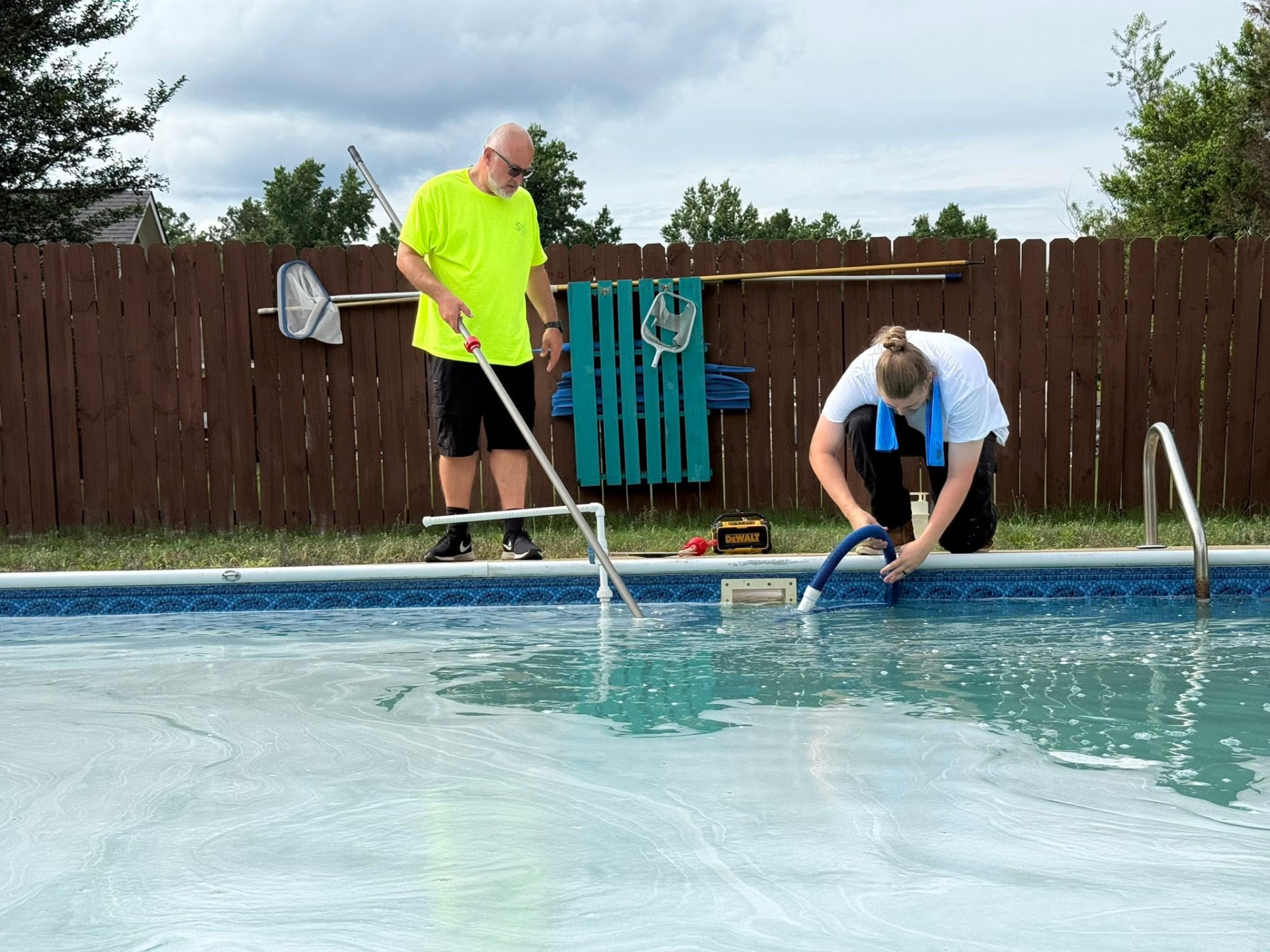 Southern Aloha Pools technicians servicing a residential swimming pool